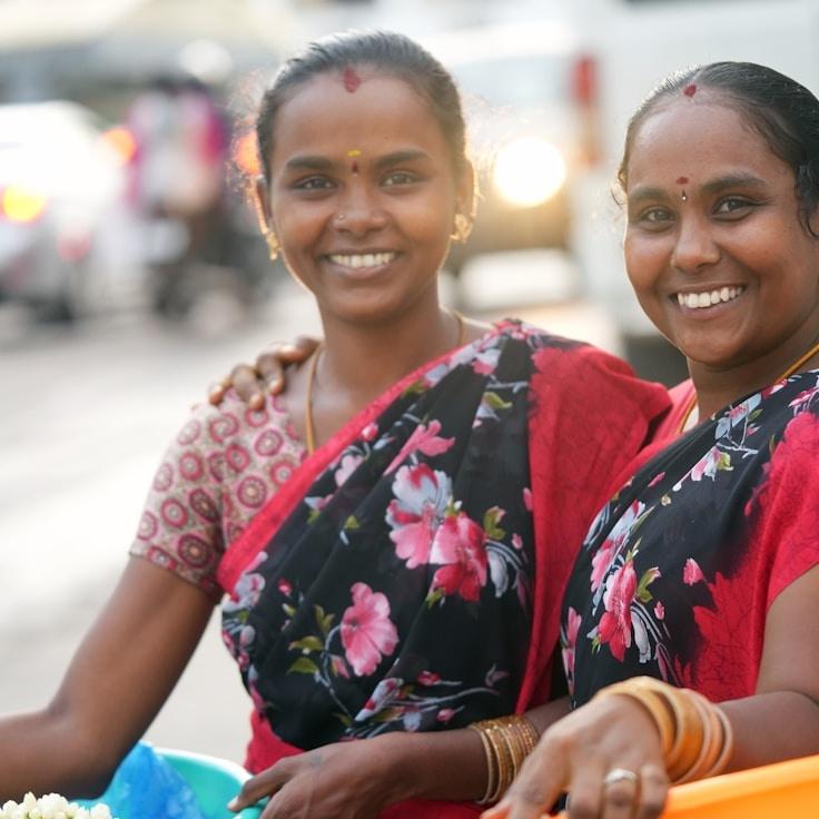 Avery Chen, Lead Design Curator at Pebble Trail Forge, reviewing corporate floral arrangements